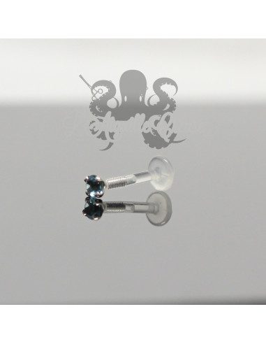 Zircon rond de couleur et griffes en or blanc 18 carats