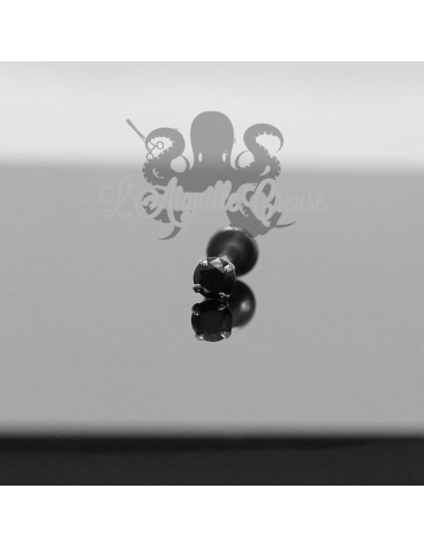 Diamant noir griffé d'or blanc 18 carats pour 1.2 mm