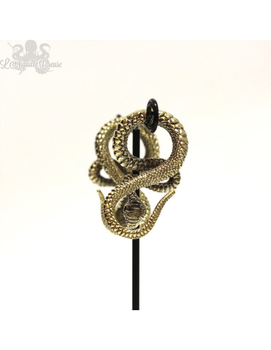 Paire de poids en bronze jaune Serpents